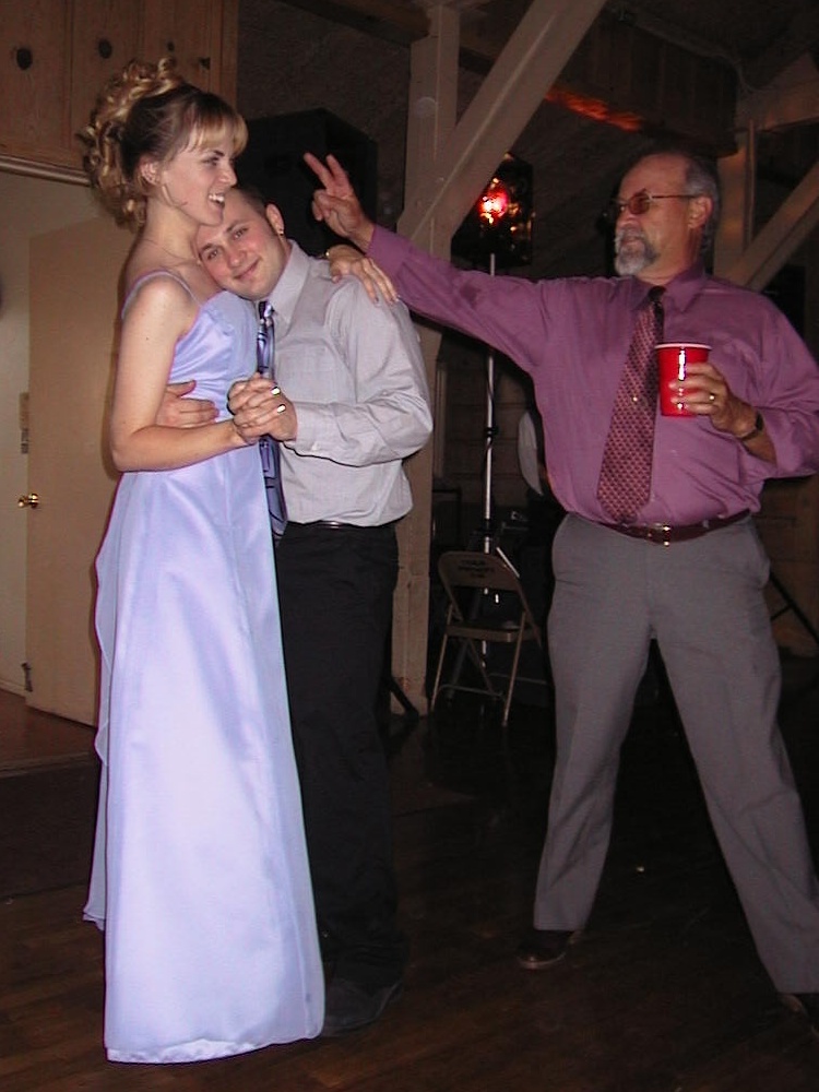 a man and two women doing a dance