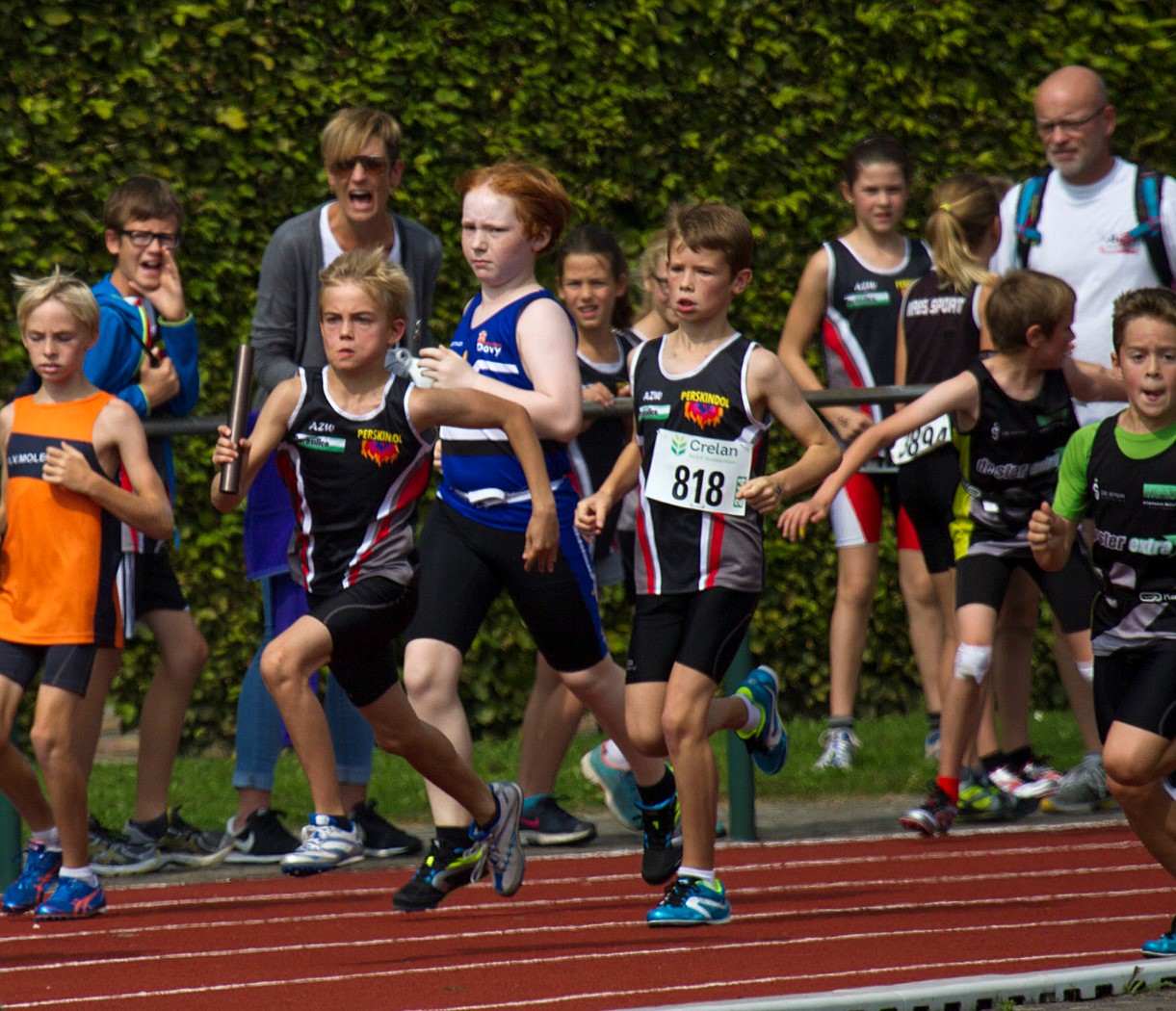 a group of children running in a race