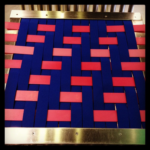 an abstract pattern that uses red and blue strips to create a wall