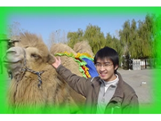a man is holding up a camel while wearing a green hat