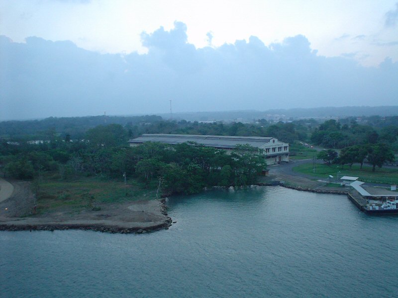 an overhead view of a large building and waterway