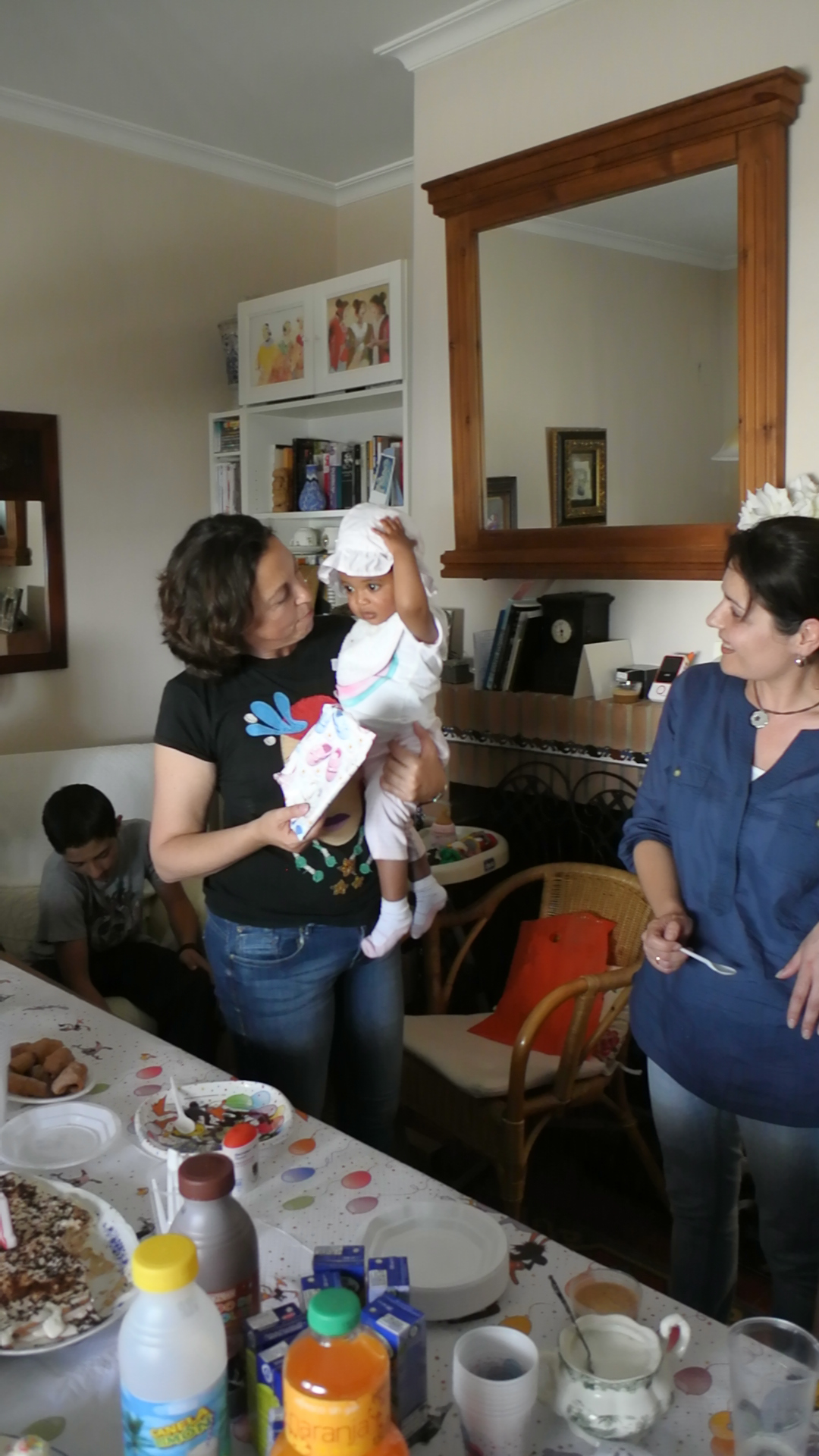 two women are talking with one another about their food