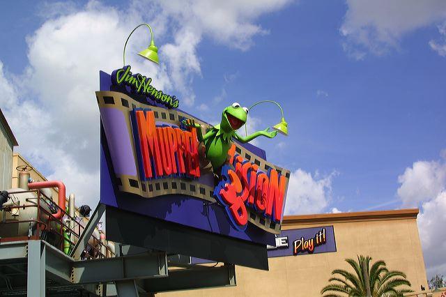 a brightly colored sign on top of the store
