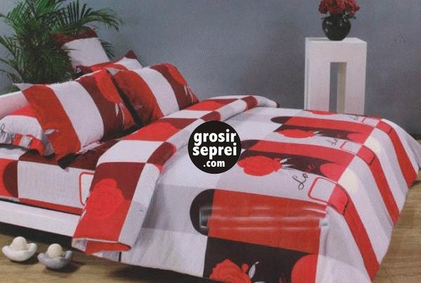 the bed has red and white  sheets