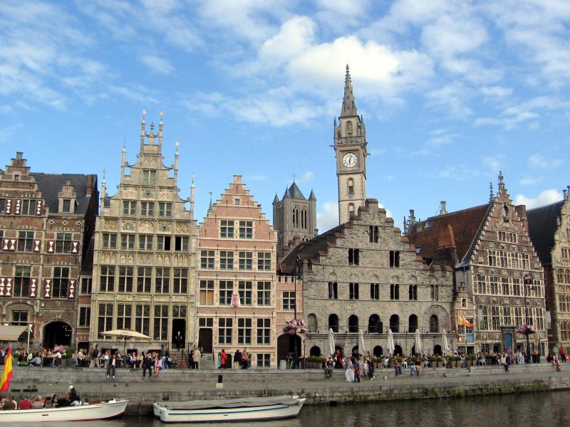 a picture of a very old building next to a river