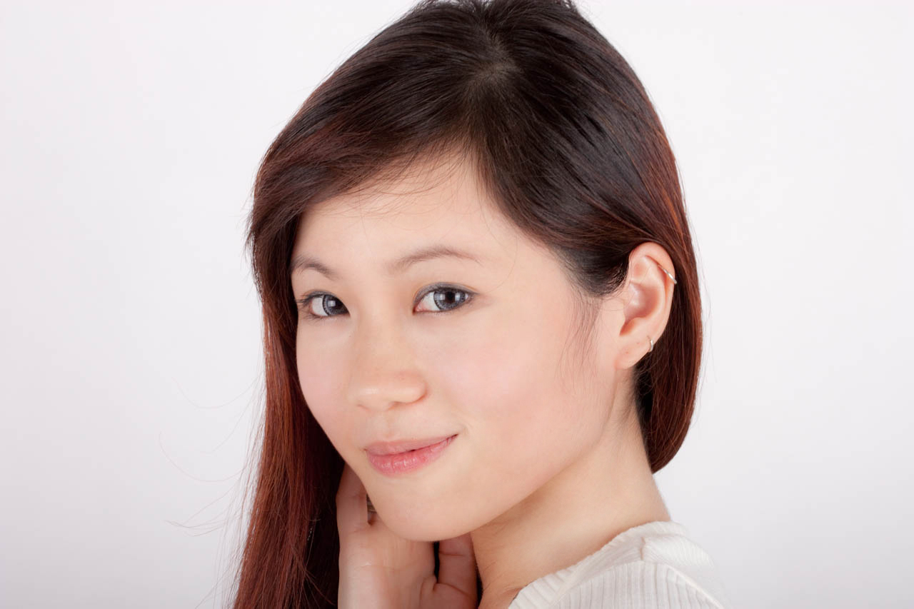 the asian woman is posing for a portrait