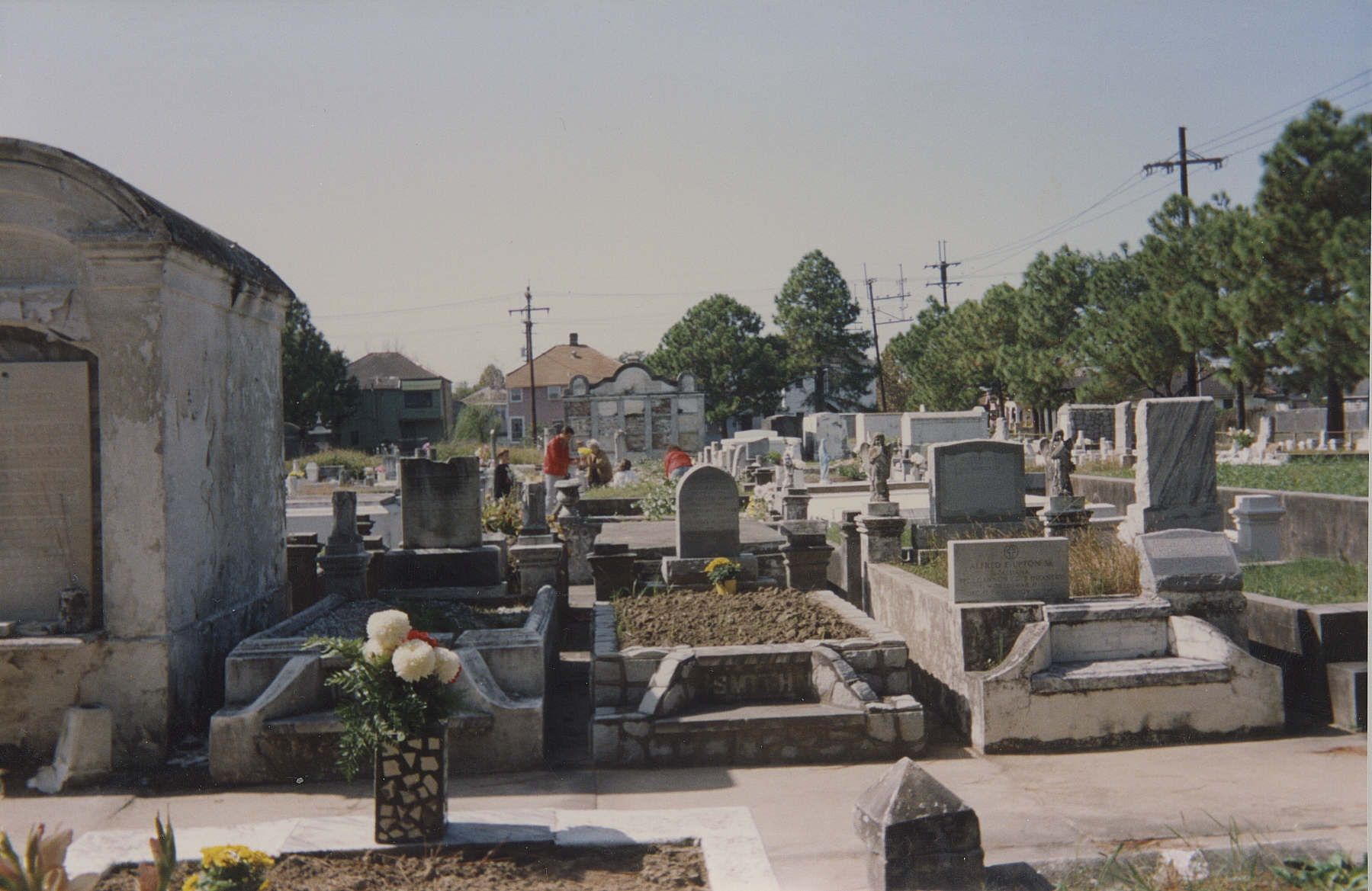 old cemetery, showing graves and flowers in a pot