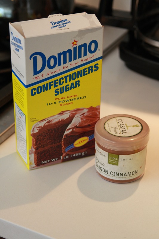 a box of cake and a small jar of confections