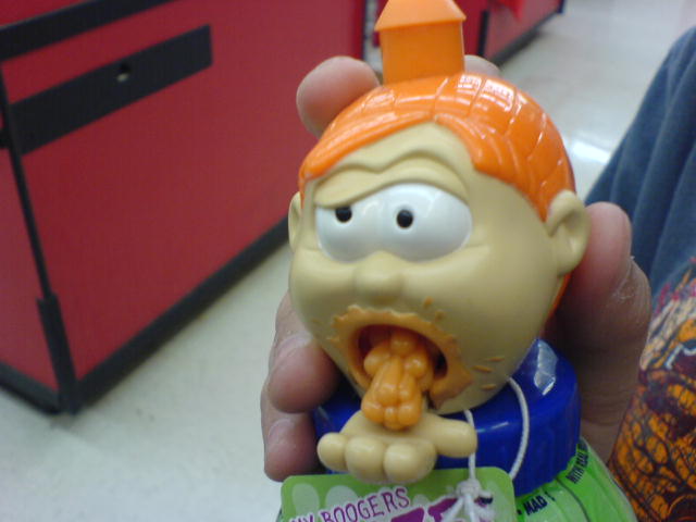 a person holding a spongebob action toy in their hand