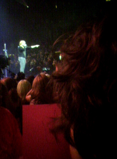 a man is in the audience at a concert