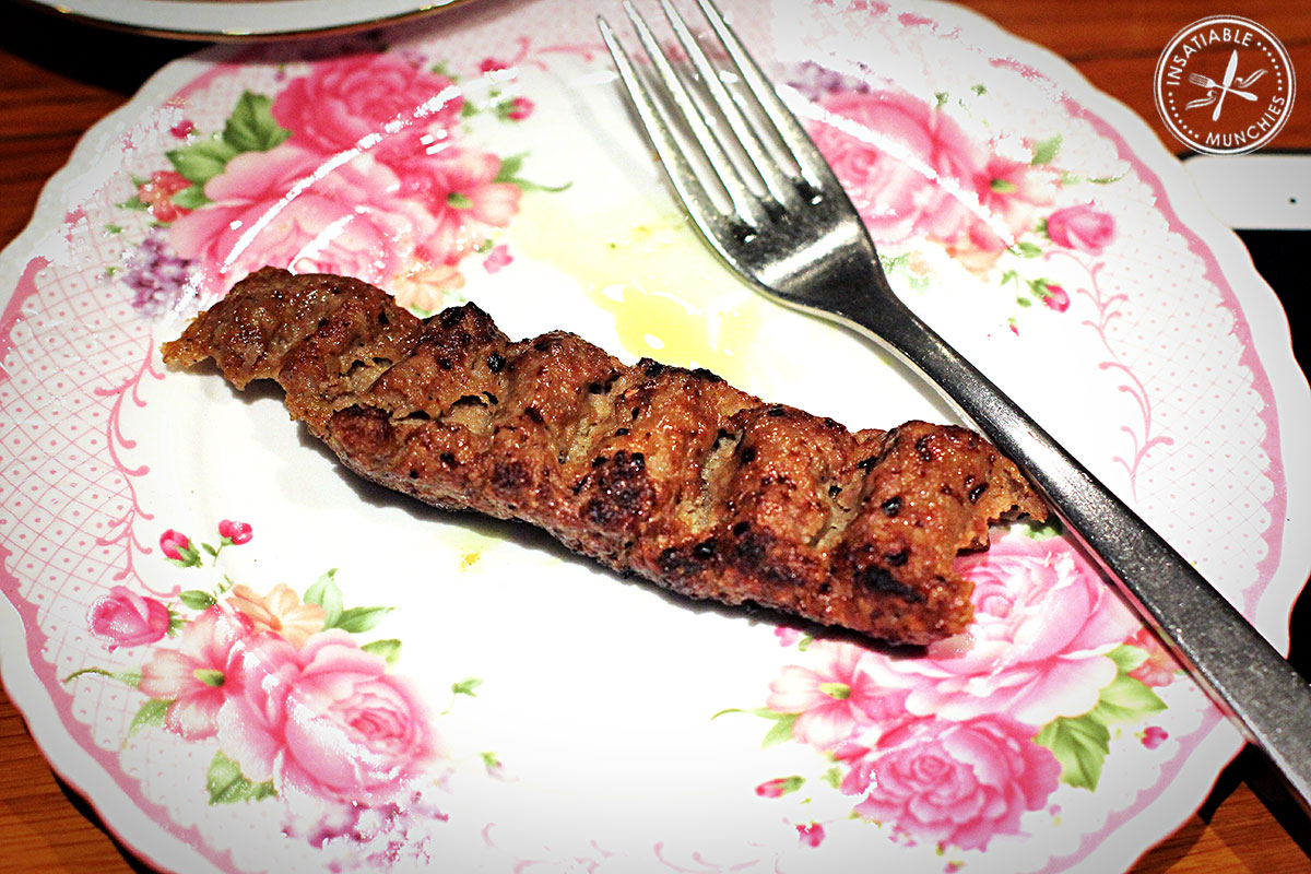 there is a fork and a food item on a plate