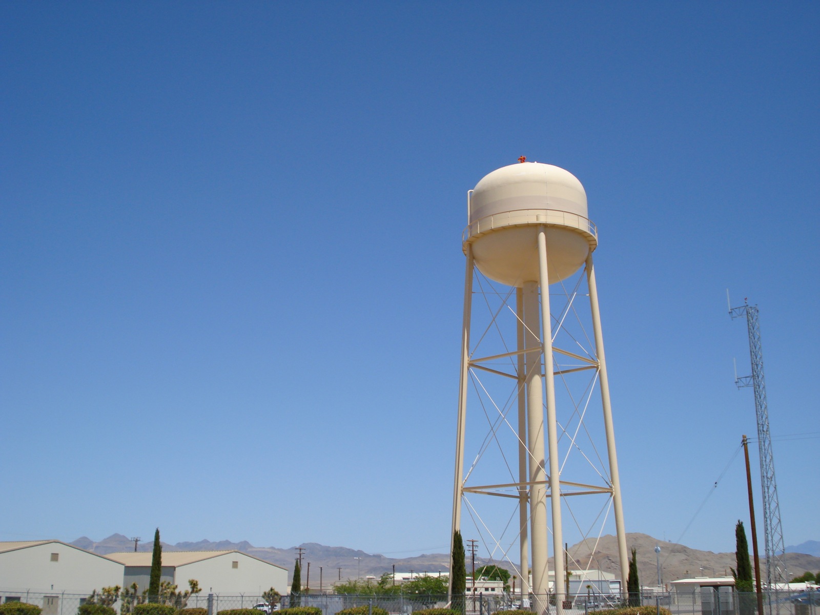 a water tower in the middle of a desert