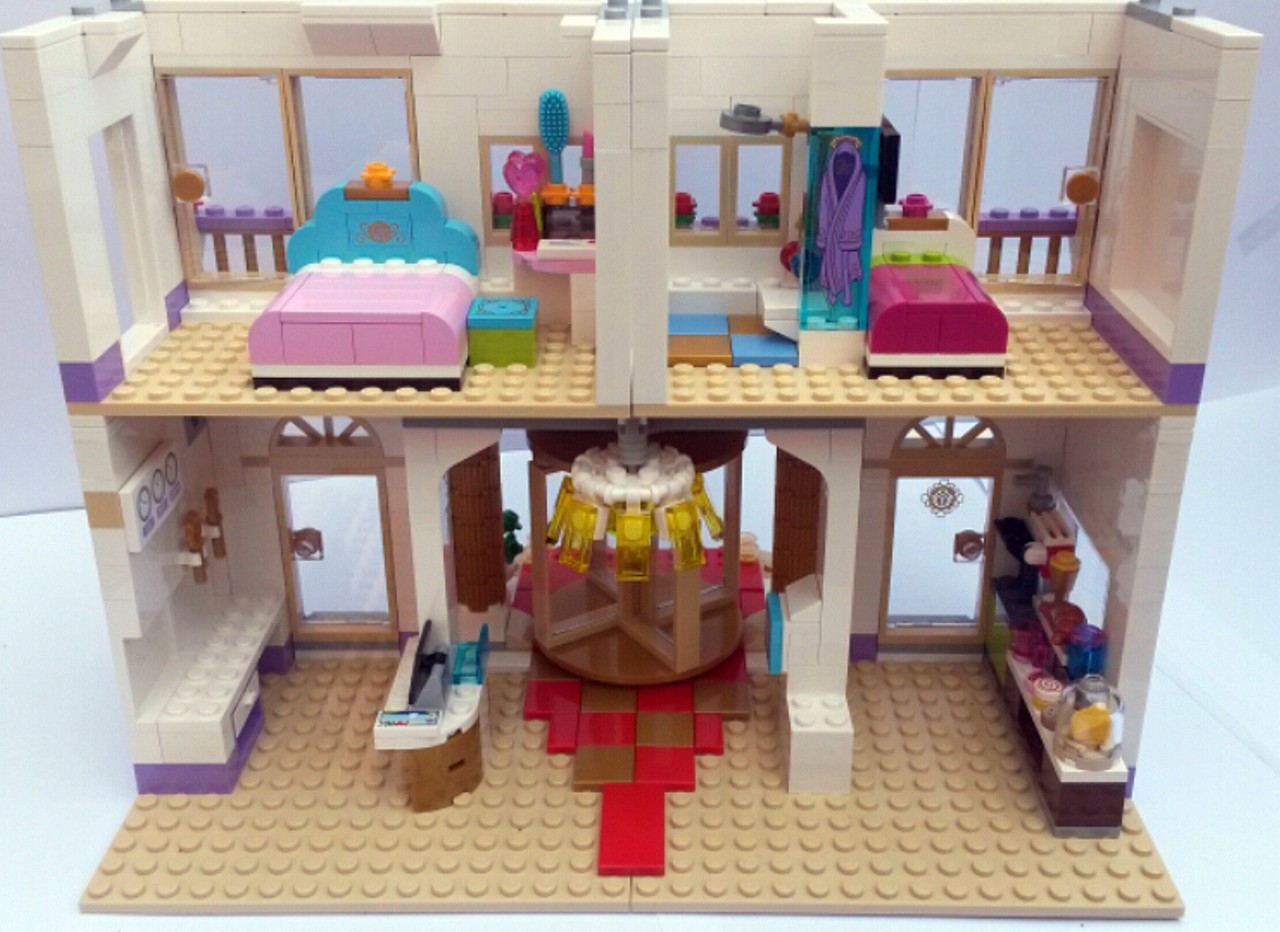 a lego dollhouse filled with furniture, furniture and toys
