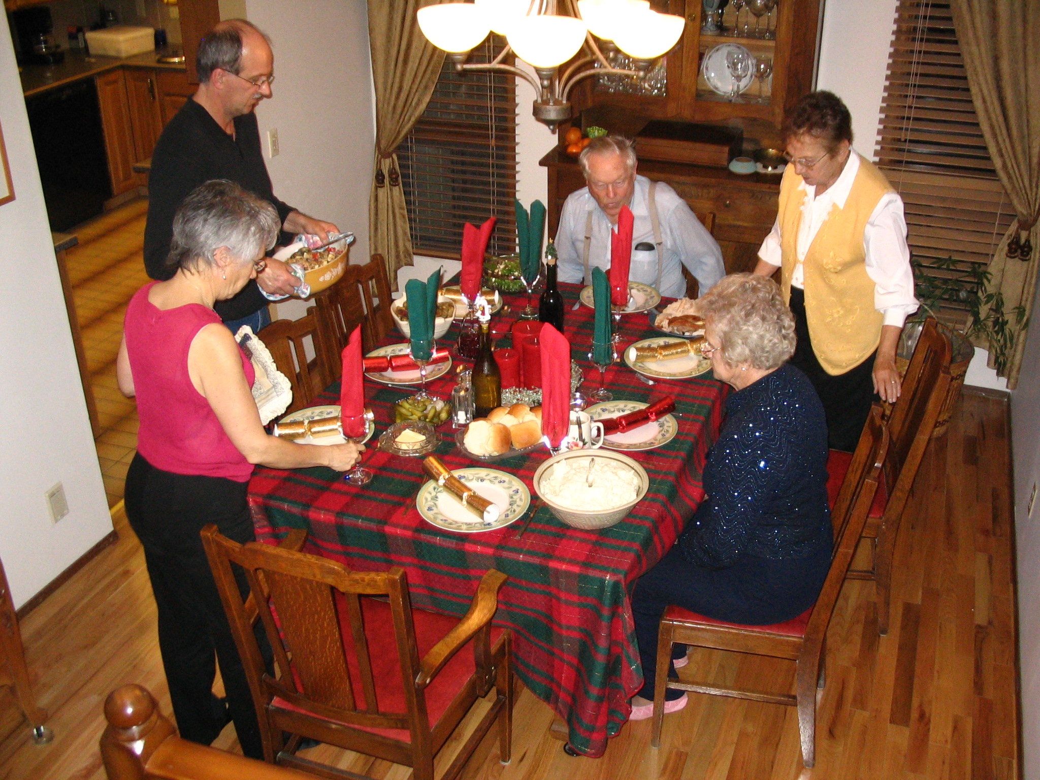 some people are sitting at a table in the middle of a meal