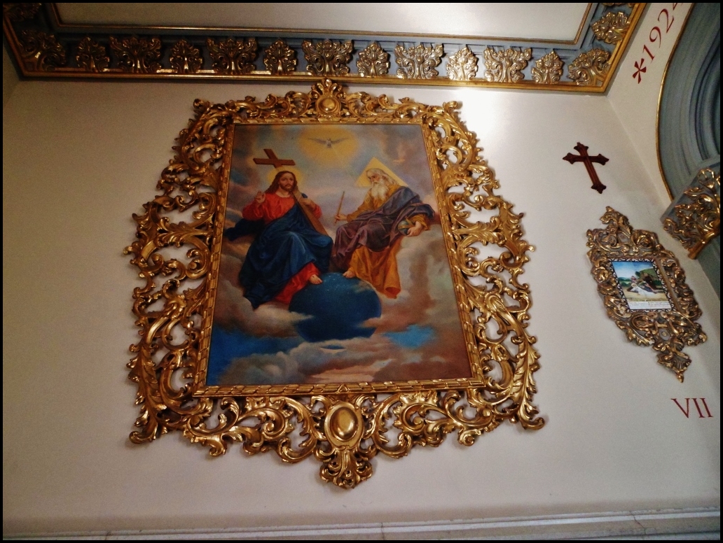 a painting is hanging on the wall above another painting