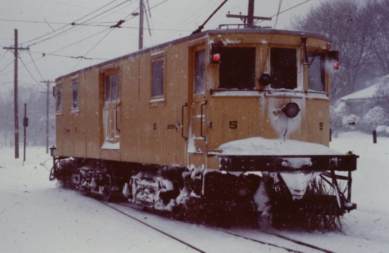 a train on the tracks in winter covered with snow