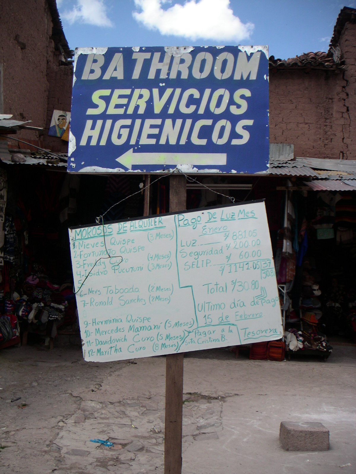 sign with writing on it in front of a building