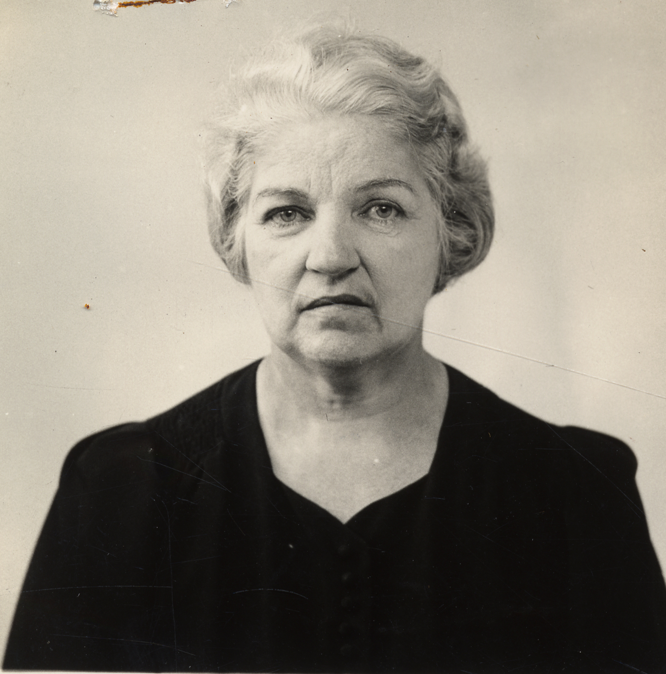 a vintage black and white pograph shows an old woman's face