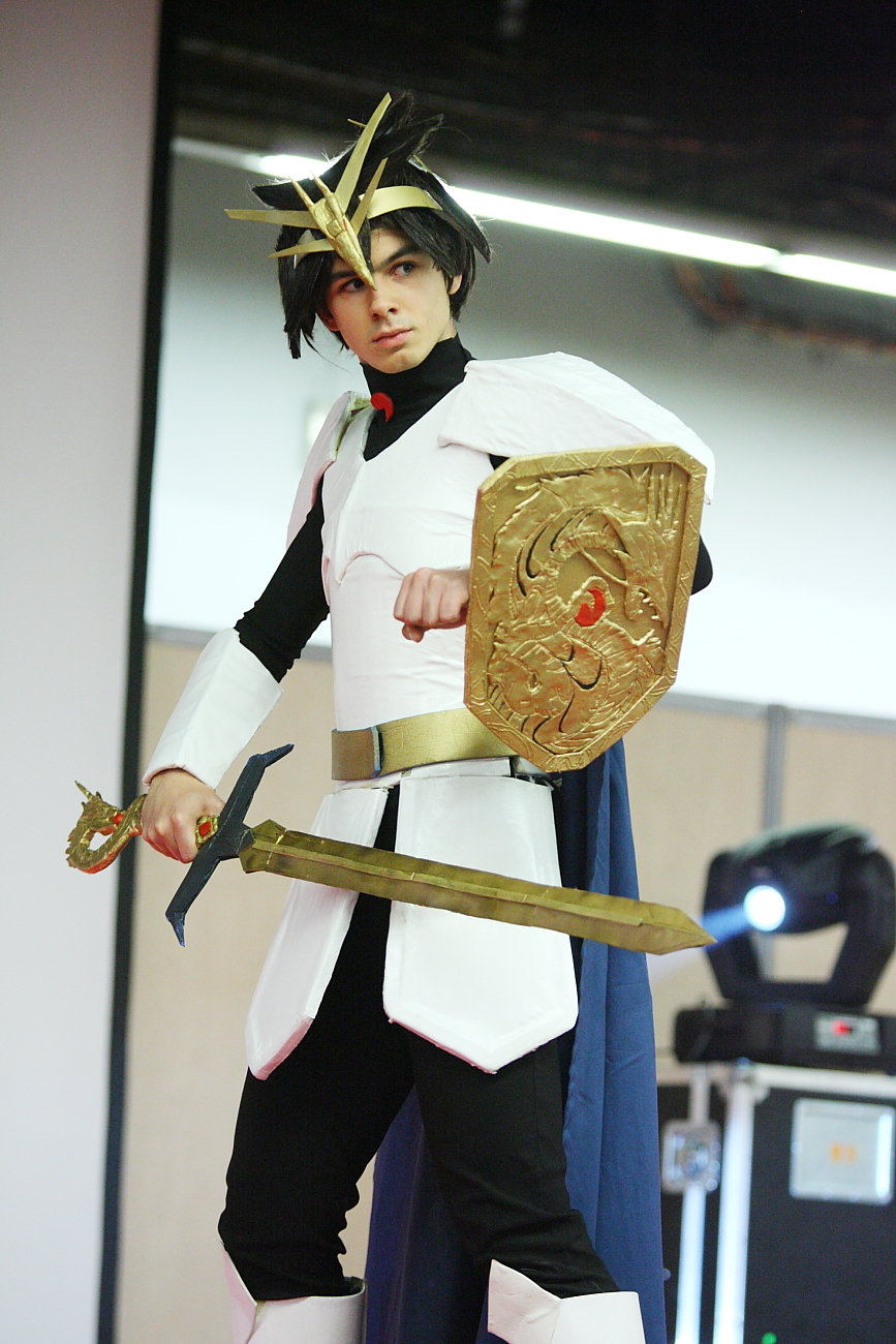 a person in an unusual costume holding two swords