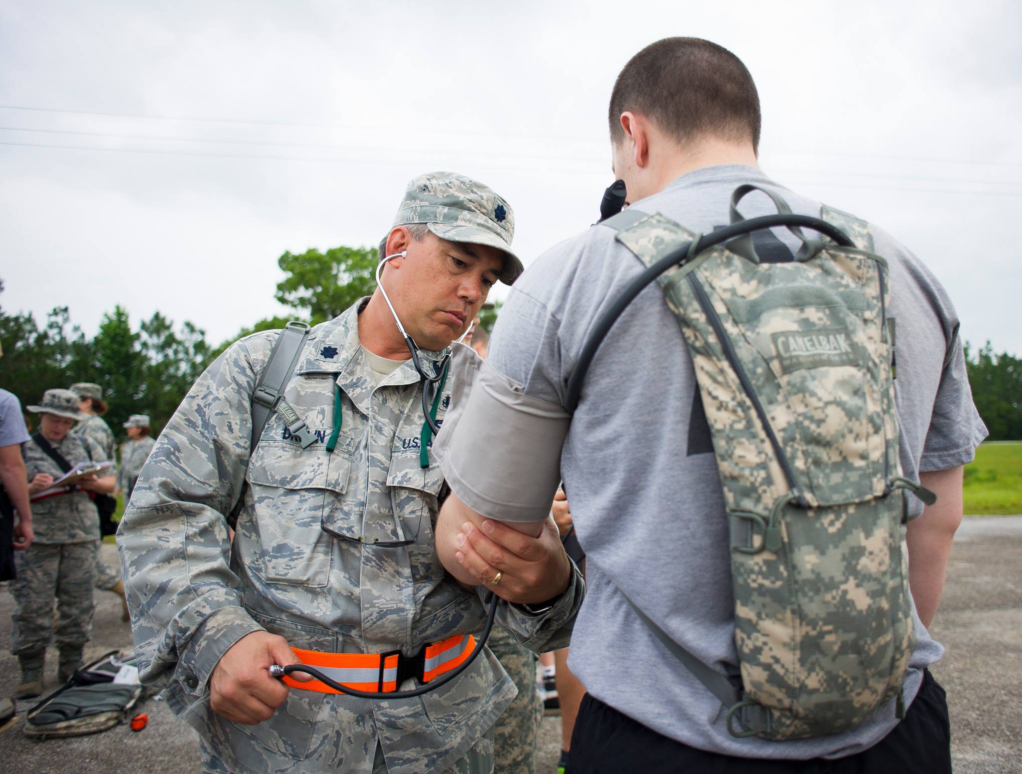 two men in fatigues check out a map