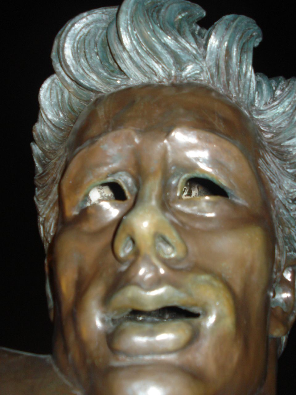 a statue has an odd look on his face