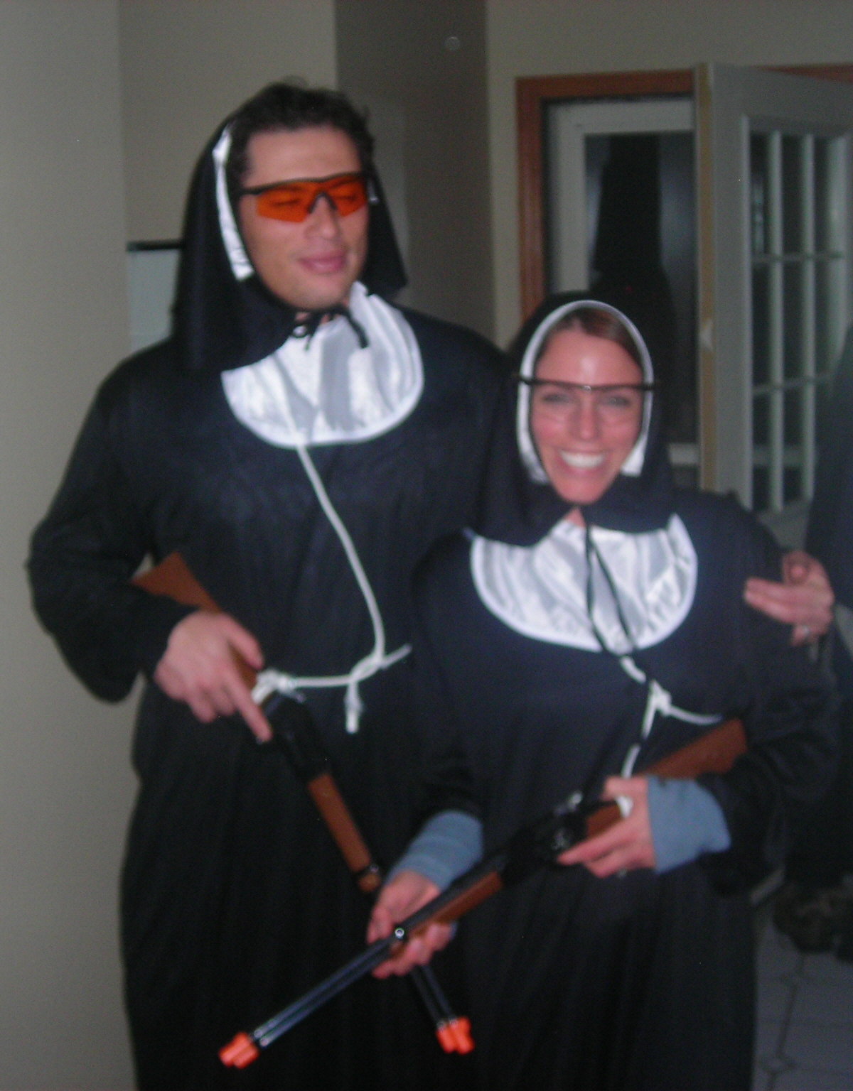 a man and woman dressed as nun and nunette costumes