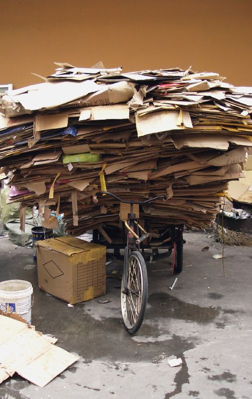 a bicycle with a large amount of mail in the back