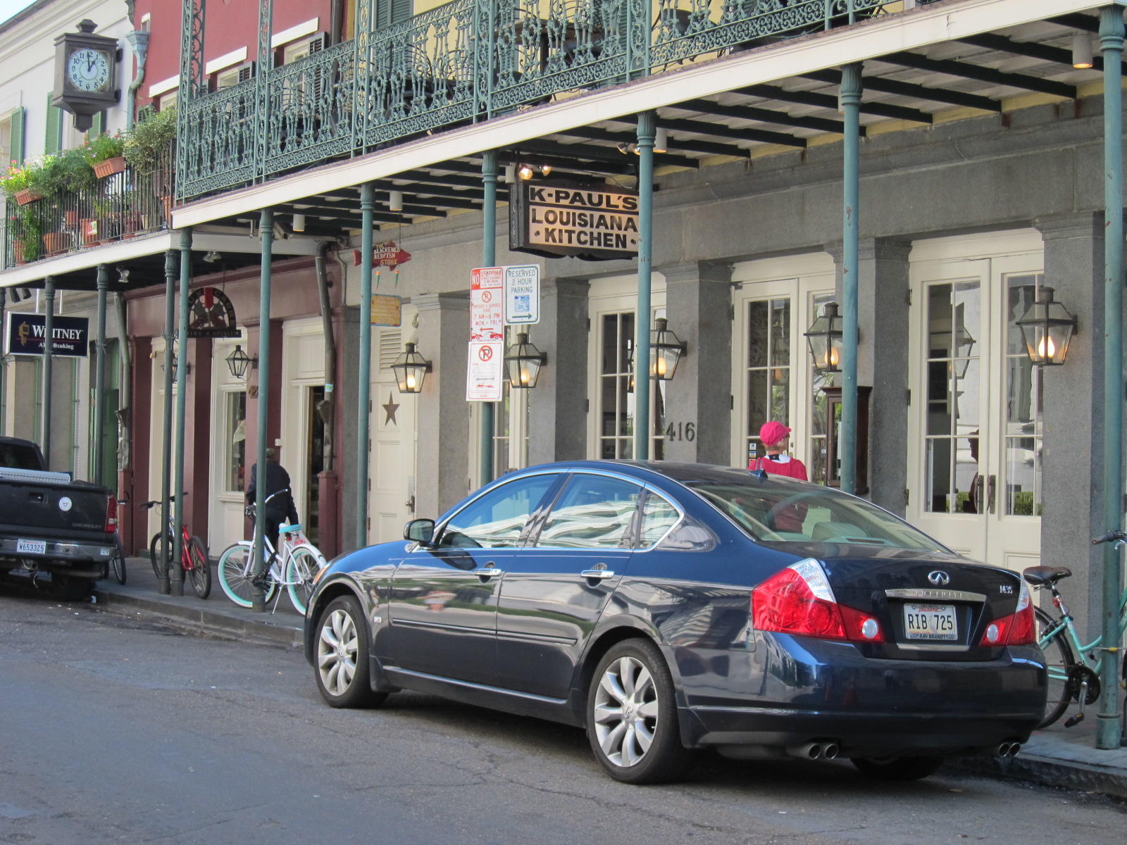 a car is parked next to a building