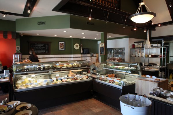 the inside of a deli with a buffet and display case