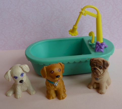 a bunch of animals sitting around a bathtub