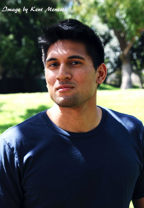 a young man looks up at the camera