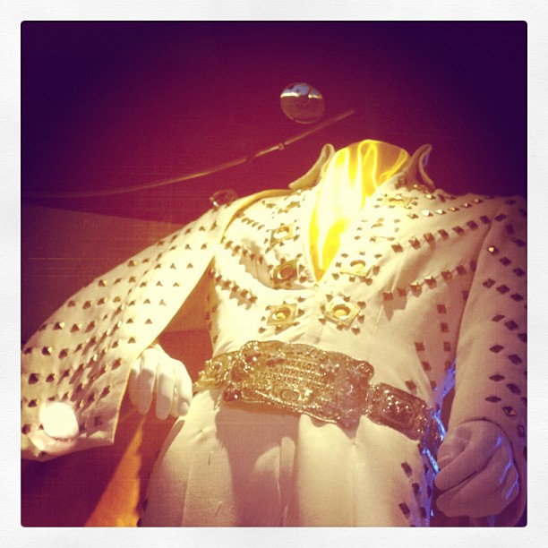 the shirt is adorned with beads and sequins