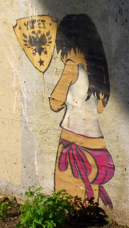 a painted sign of a girl with an umbrella
