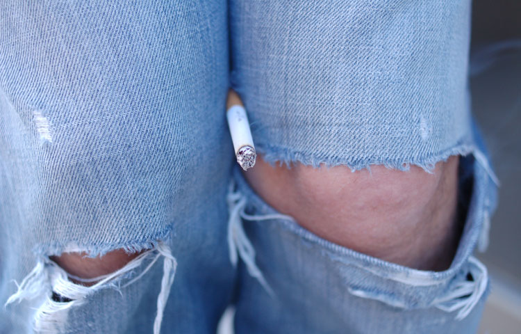 there is a cigarette in between jeans