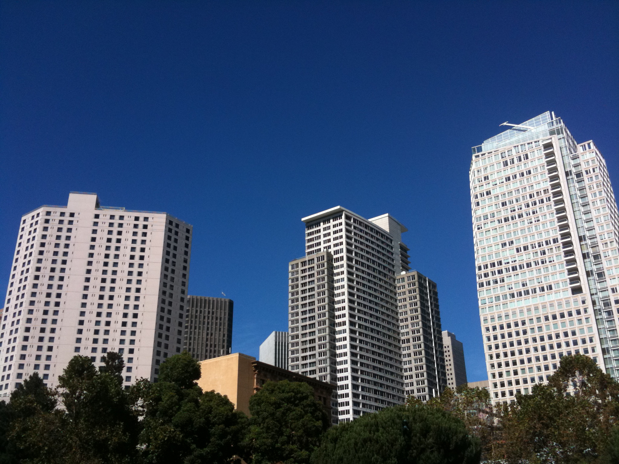 tall white buildings in a very downtown area