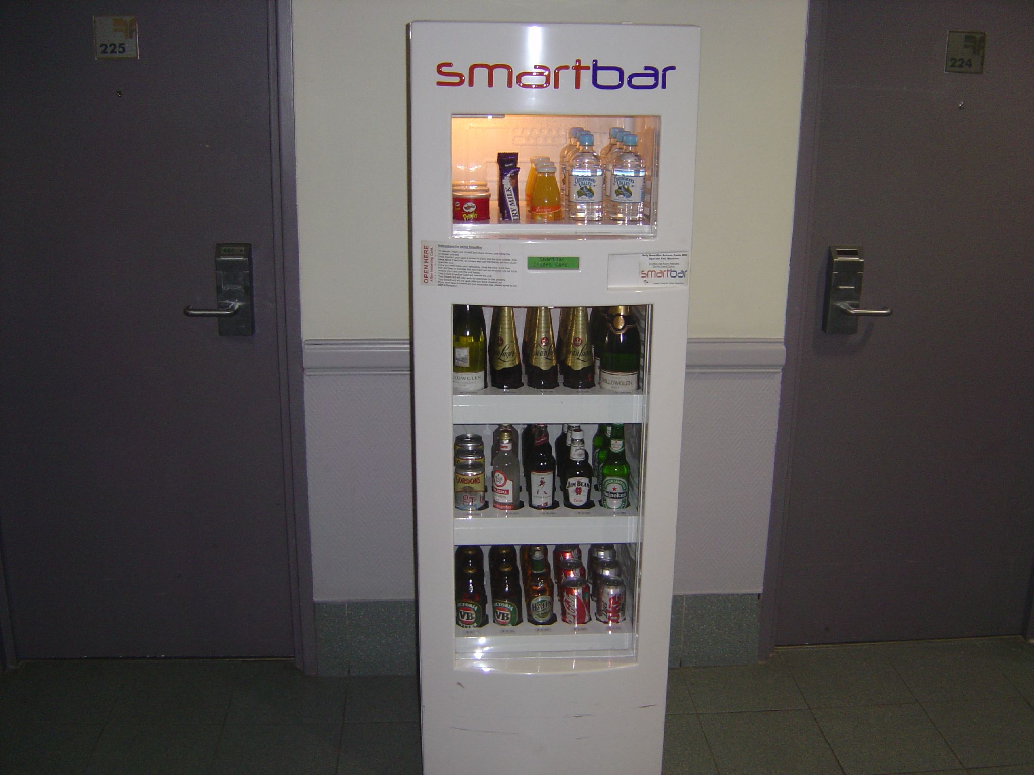 a refrigerator with different kinds of bottles in it