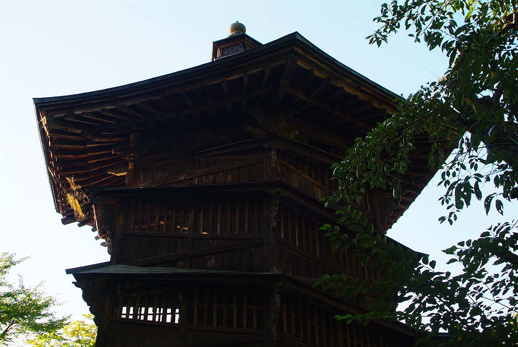 a wooden structure with a clock on it