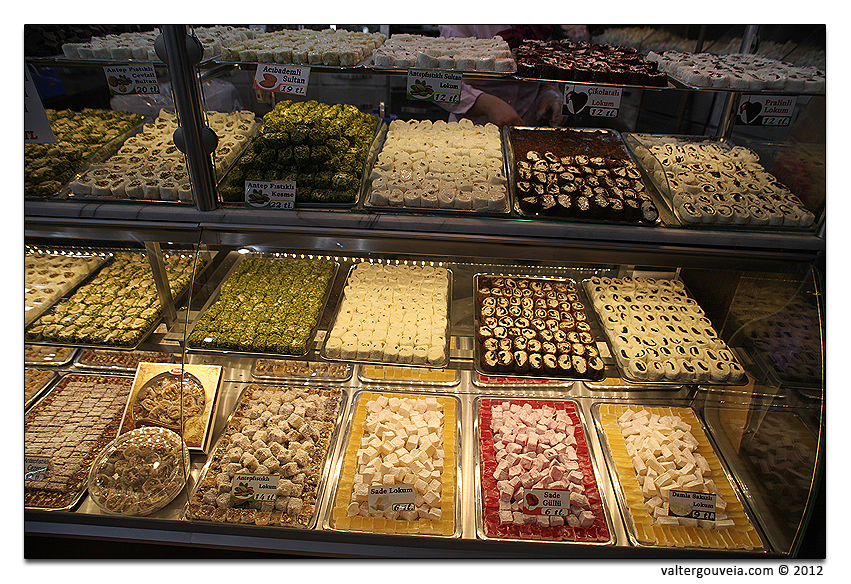 many different desserts on display in a showcase case