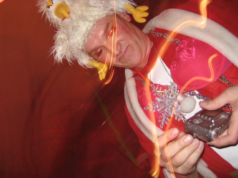 a man in costume is holding a cellphone