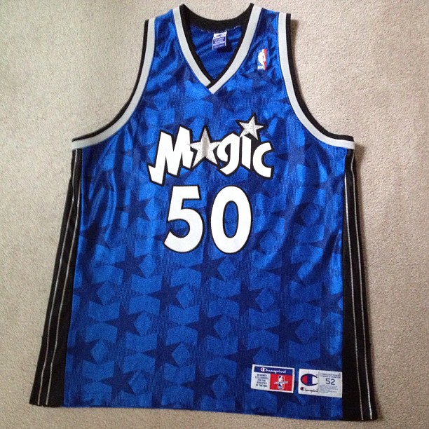 a blue basketball jersey on the floor with a 50 patch