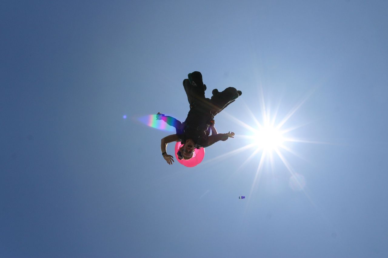 an image of a person riding a snowboard in the air