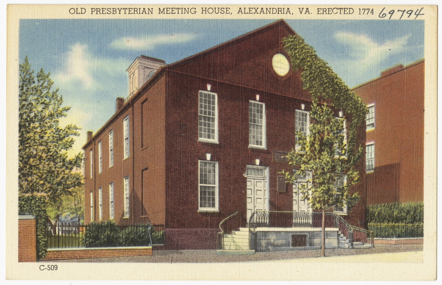 an old red brick building is shown with many windows