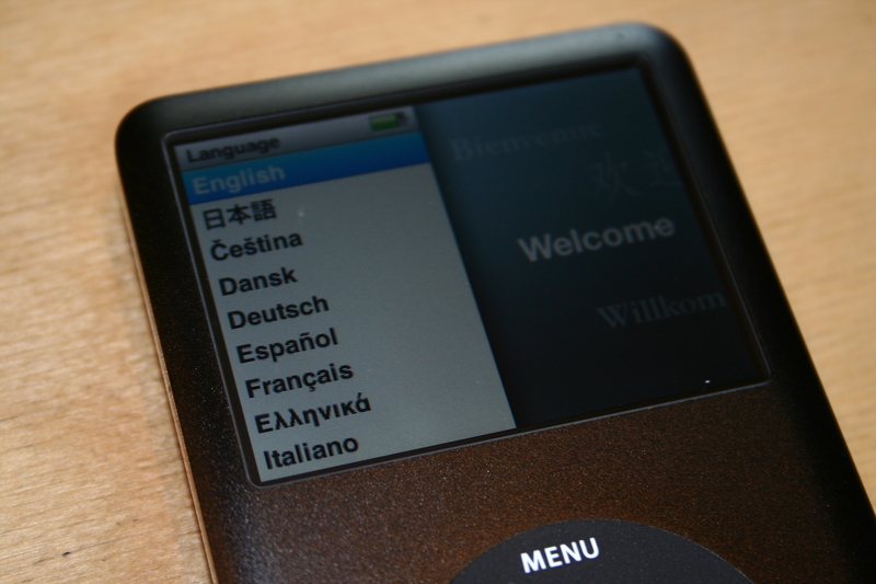 an ipod on display with a menu screen