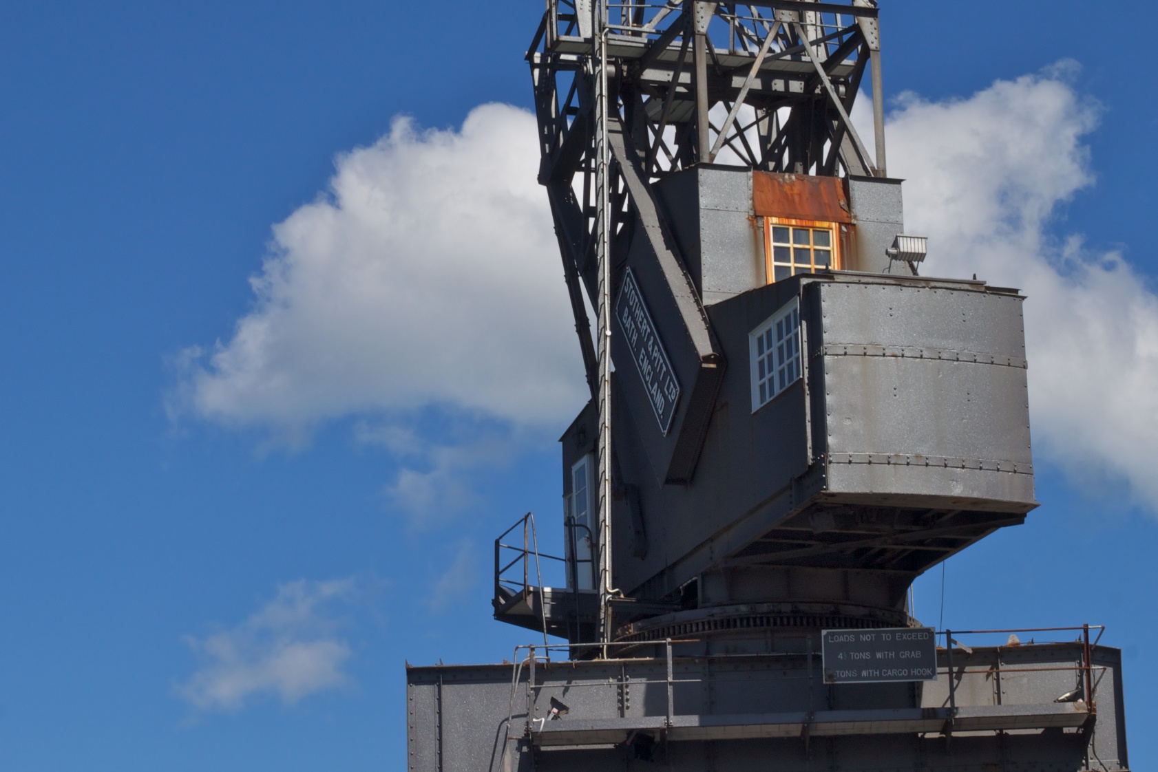 a steel structure is on top of a tall building