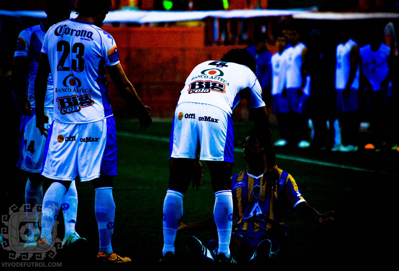 two teams of soccer players in uniform stand together