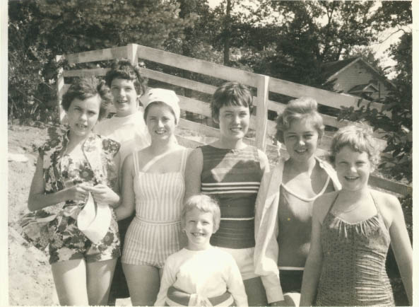 a black and white po of children in bathing suits