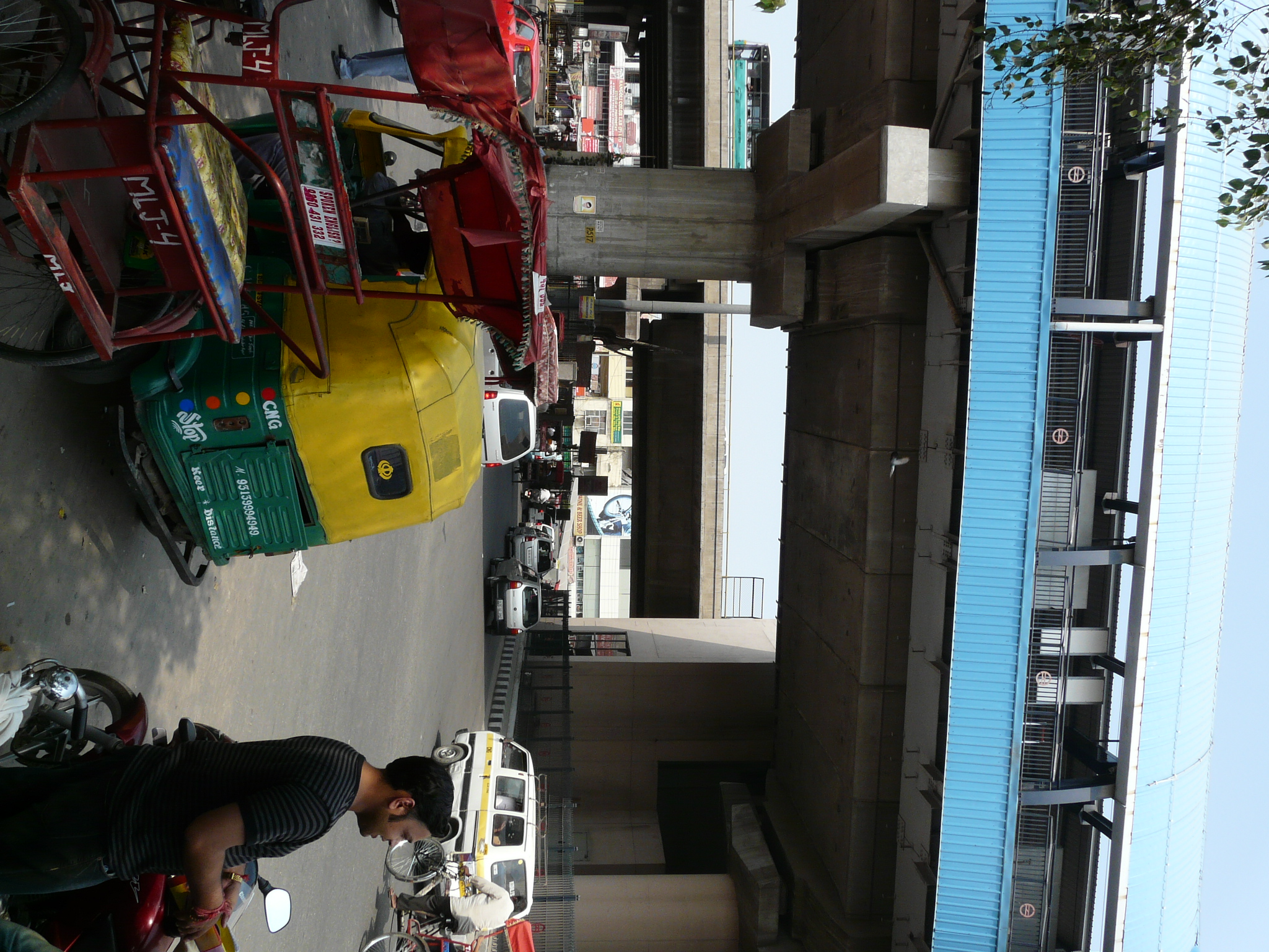 people on motorcycles are standing in front of a busy street