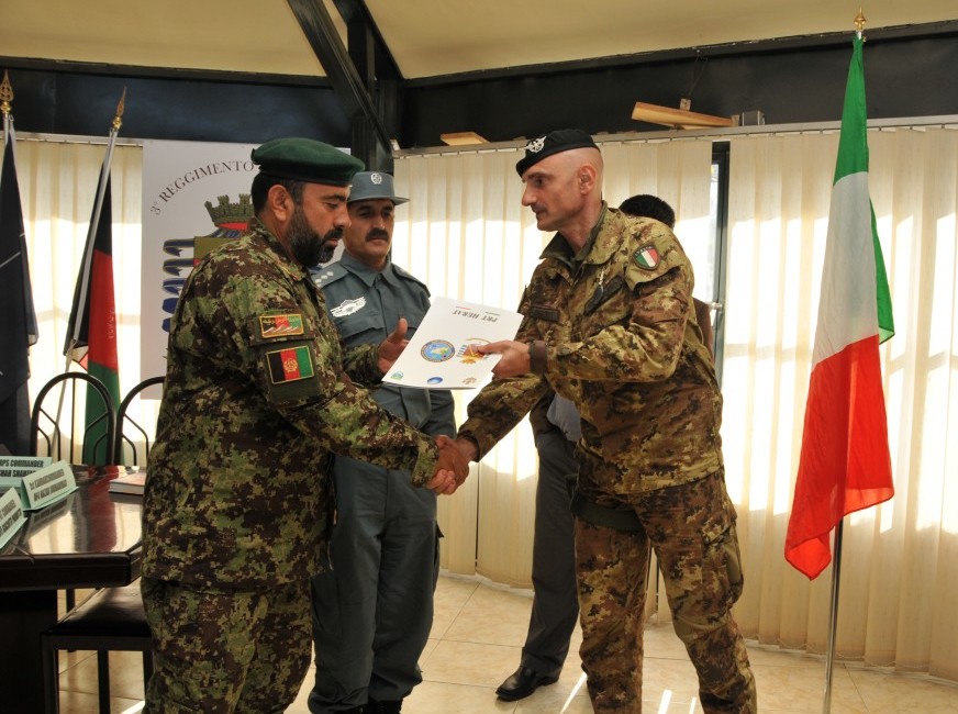 a couple of men shaking hands with another man