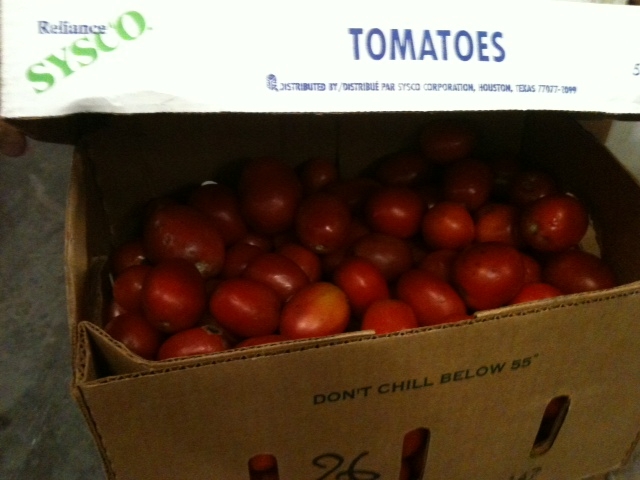 the box contains tomatoes and is ready to be picked up