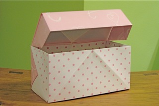 an open gift box that is sitting on a table